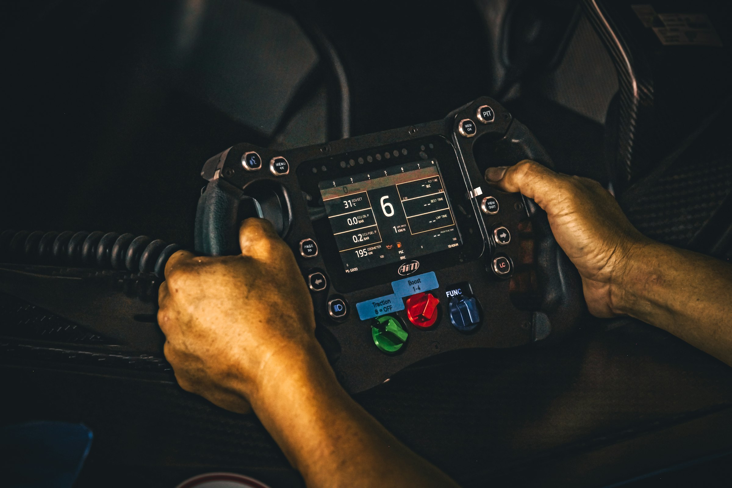Race car cockpit and steering wheel